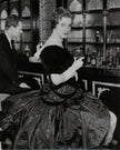 Dita Marlow in a cocktail dress