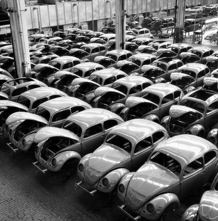 Painted car bodies on transport racks