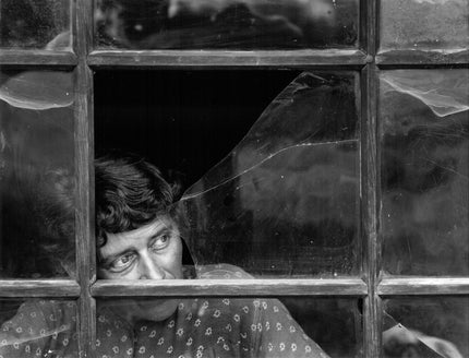 Portrait behind broken window