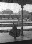 Figure behind wet glass