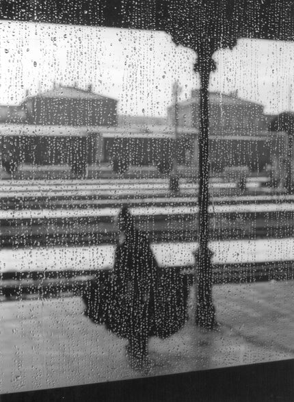 Figure behind wet glass