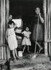 Familie in einem Maya-Dorf
