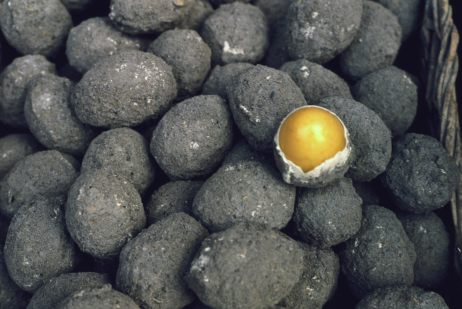Eggs preserved and stored in lime, salt, ash, spices, soda and tea