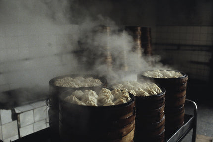 Baozi in hohen Bambus-Dampfkochern